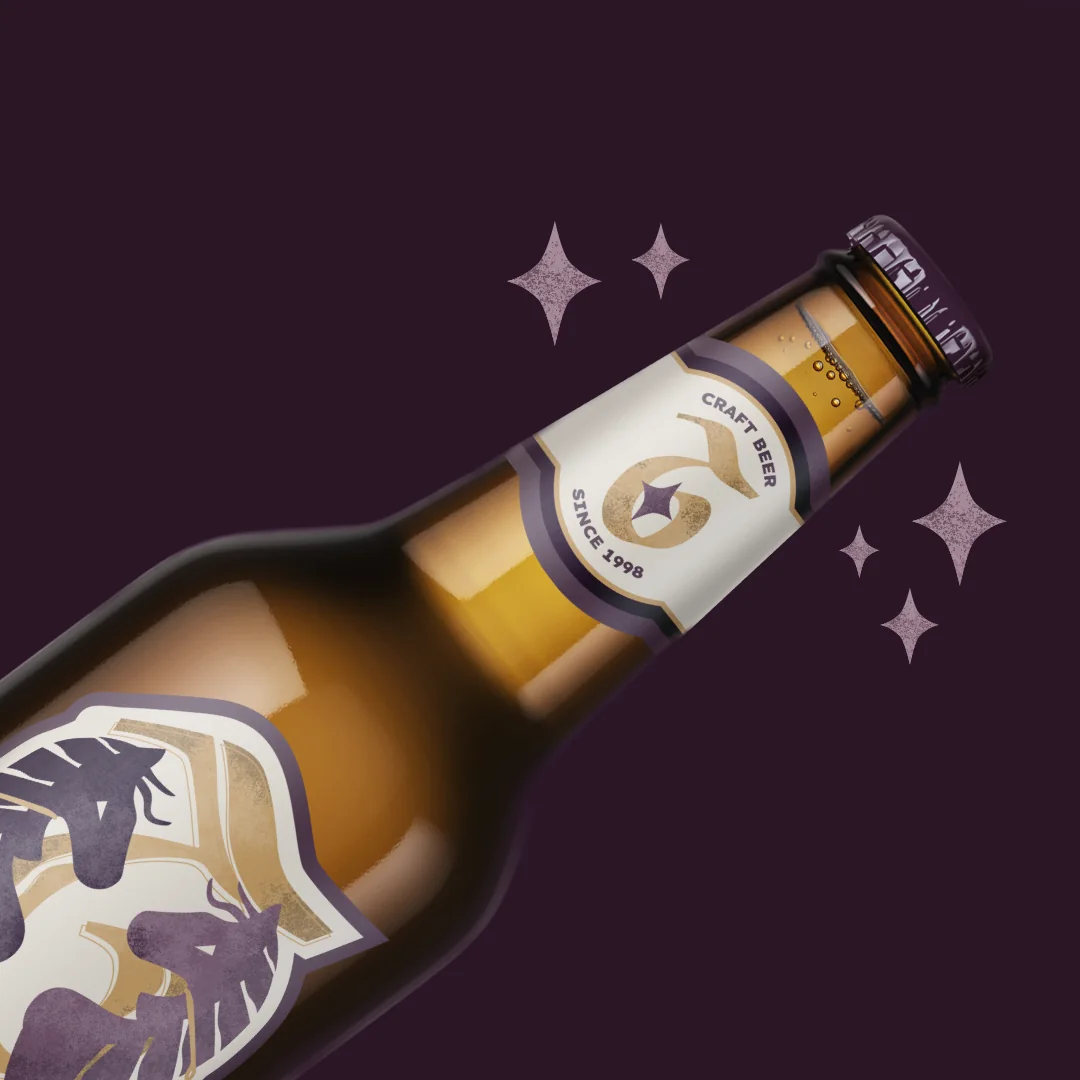 Close-up of the bottle neck label on dark plum with stars